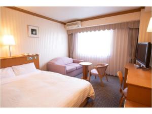 Postel nebo postele na pokoji v ubytování Hotel Castle Inn Ise Meotoiwa