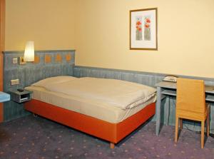 Letto o letti in una camera di Hotel Simi