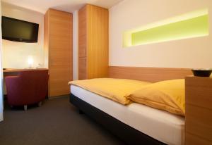 Letto o letti in una camera di Hotel Simi