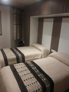 En eller flere senger på et rom på Hostal El Duende Blanco