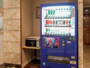 a vending machine filled with soda and sodas at Hotel Castle Inn Tsu in Tsu