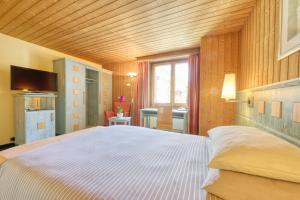 Letto o letti in una camera di Hotel Simi