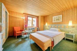 Letto o letti in una camera di Hotel Simi