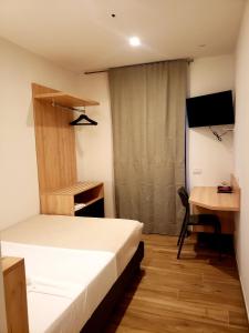 Posteľ alebo postele v izbe v ubytovaní Hotel Cantaleone