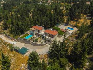 an aerial view of a house with a swimming pool at Sea View Two Bedroom Villa Giorgios in Gavalochori