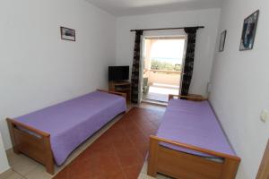 Postel nebo postele na pokoji v ubytování Apartments and rooms with parking space Mandre, Pag - 6309