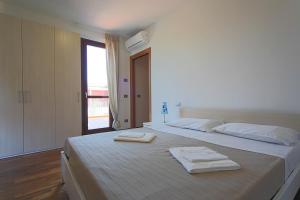 Postel nebo postele na pokoji v ubytování Adamo ed Eva Resort