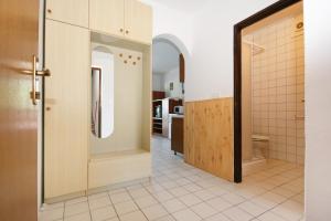a room with a door and a hallway with a kitchen at Seaside apartments with a swimming pool Potocnica, Pag - 6407 in Borovići +47 photos
