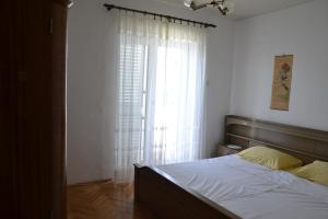 Ein Bett oder Betten in einem Zimmer der Unterkunft Apartments by the sea Kustici, Pag - 6335