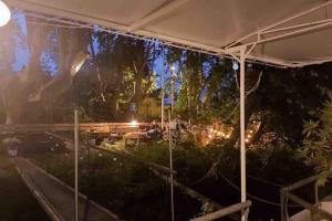a white tent with lights in a garden at night at Location Péniche Avignon in Avignon