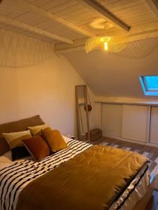 Ένα ή περισσότερα κρεβάτια σε δωμάτιο στο La Maison bleue