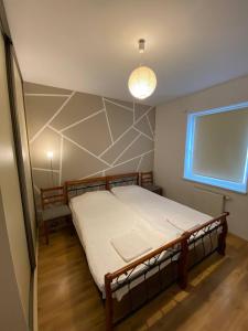 Posteľ alebo postele v izbe v ubytovaní Murano Apartaments Nova Praga