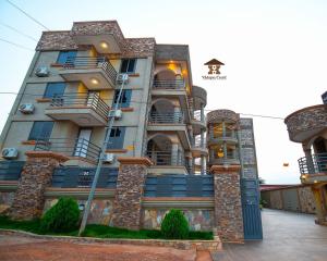 a large building with balconies on the side of it at Adepa Court Luxury Apartment Services in Kumasi