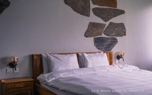 Postel nebo postele na pokoji v ubytování Silk Route Lodge - Hunza
