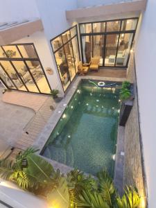 an overhead view of a swimming pool in a house at Villa Bali Jeddah in Jeddah