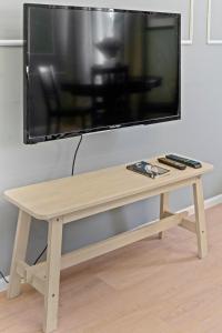 A television and/or entertainment centre at Venus Apartments - Akacfa I