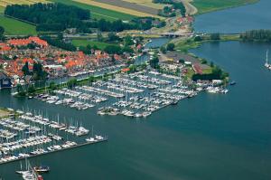 an aerial view of a harbor full of boats at Surla luxury sailing Houseboat Splendid at Marina Monnickendam in Monnickendam