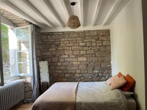 Posteľ alebo postele v izbe v ubytovaní Salins-les Bains : A l'ombre de La Tour Carrée
