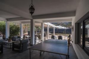 a living room with a table and chairs at Haus Apart Hotel in Salta