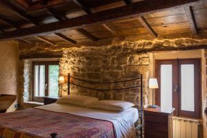 Giường trong phòng chung tại Casetta la Crus - Romantic house