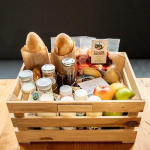 a wooden crate filled with food and other food items at Alice Chalet Bled in Bled