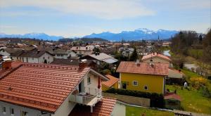 a view of a town with houses and mountains at Ferienwohnung Kunze in Prien am Chiemsee