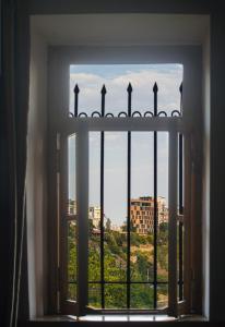 a window with a view of a city at Apartment in the heart of Old Tbilisi in Tbilisi City