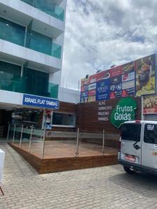 a van parked in front of a building at Ravenna Imóveis - Flats Mobiliados Tambaú in João Pessoa