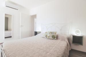 A bed or beds in a room at La Terrazza di Walter