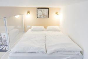 Posteľ alebo postele v izbe v ubytovaní Venus Apartments - Dohany Street III + 11 fotografií