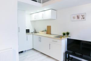 Kuchyň nebo kuchyňský kout v ubytování Venus Apartments - Dohany Street III