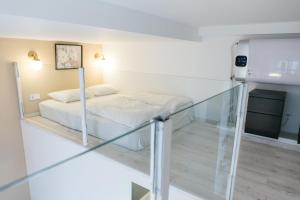 Postel nebo postele na pokoji v ubytování Venus Apartments - Dohany Street III