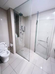 a bathroom with a shower and a toilet at Connected train 1 Bedroom (ABOVE MALL)7 in Kuala Lumpur