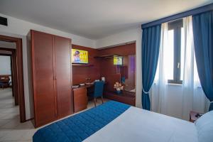 Postel nebo postele na pokoji v ubytování Best Western Hotel Nettuno + 37 fotografií