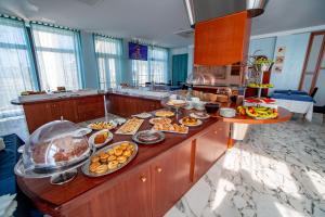 a buffet with many different types of food on it at Best Western Hotel Nettuno in Brindisi