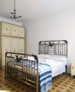 Ένα ή περισσότερα κρεβάτια σε δωμάτιο στο Da nonna Maria
