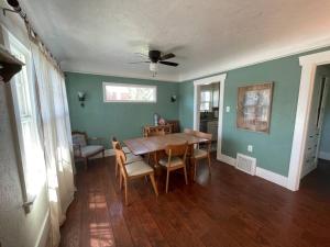 a dining room with a wooden table and chairs at Quaint house in the heart of Idaho Falls in Idaho Falls