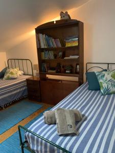Giường trong phòng chung tại Casa da Nespereira- lugar acolhedor rodeado de natureza