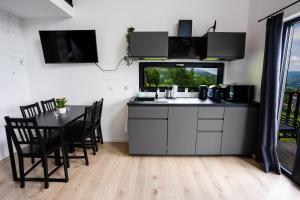 Kuchyň nebo kuchyňský kout v ubytování Cozy House + 8 fotografií