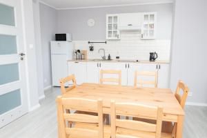 Kuchyň nebo kuchyňský kout v ubytování Apartamenty 4YOU Hel