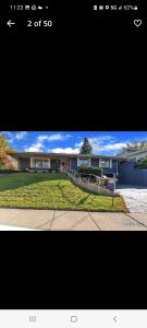 a picture of a large house with a driveway at dock, game room, bar and private river view patio in Toledo