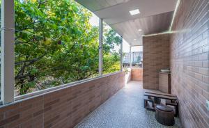 an internal courtyard with windows and a brick wall at Art-Gallery Avlabari in Tbilisi City