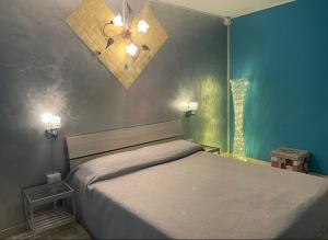 Un pat sau paturi într-o cameră la Castelpetroso Bed&Food