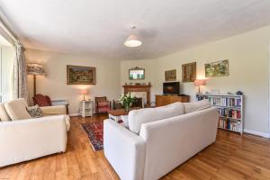 a living room with two white couches at Bell Meadow in Coldwaltham