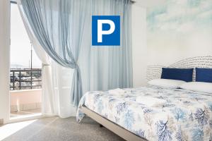 Postel nebo postele na pokoji v ubytování Acquazzurra Gaeta