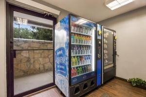 a vending machine filled with lots of drinks at HomeTowne Studios by Red Roof Princeton - Ewing/ Lawrenceville in Trenton