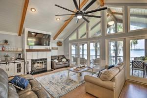 a living room with a couch and a fireplace at All Decked Out Home on Cherry Lake with Dock! in Madison