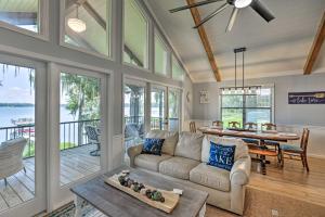 a living room with a couch and a table at All Decked Out Home on Cherry Lake with Dock! in Madison