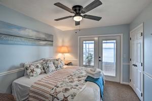 a bedroom with a bed and a ceiling fan at All Decked Out Home on Cherry Lake with Dock! in Madison