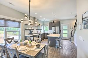 a dining room and kitchen with a table and chairs at Brand New Red Lodge Home with Private Hot Tub! in Red Lodge